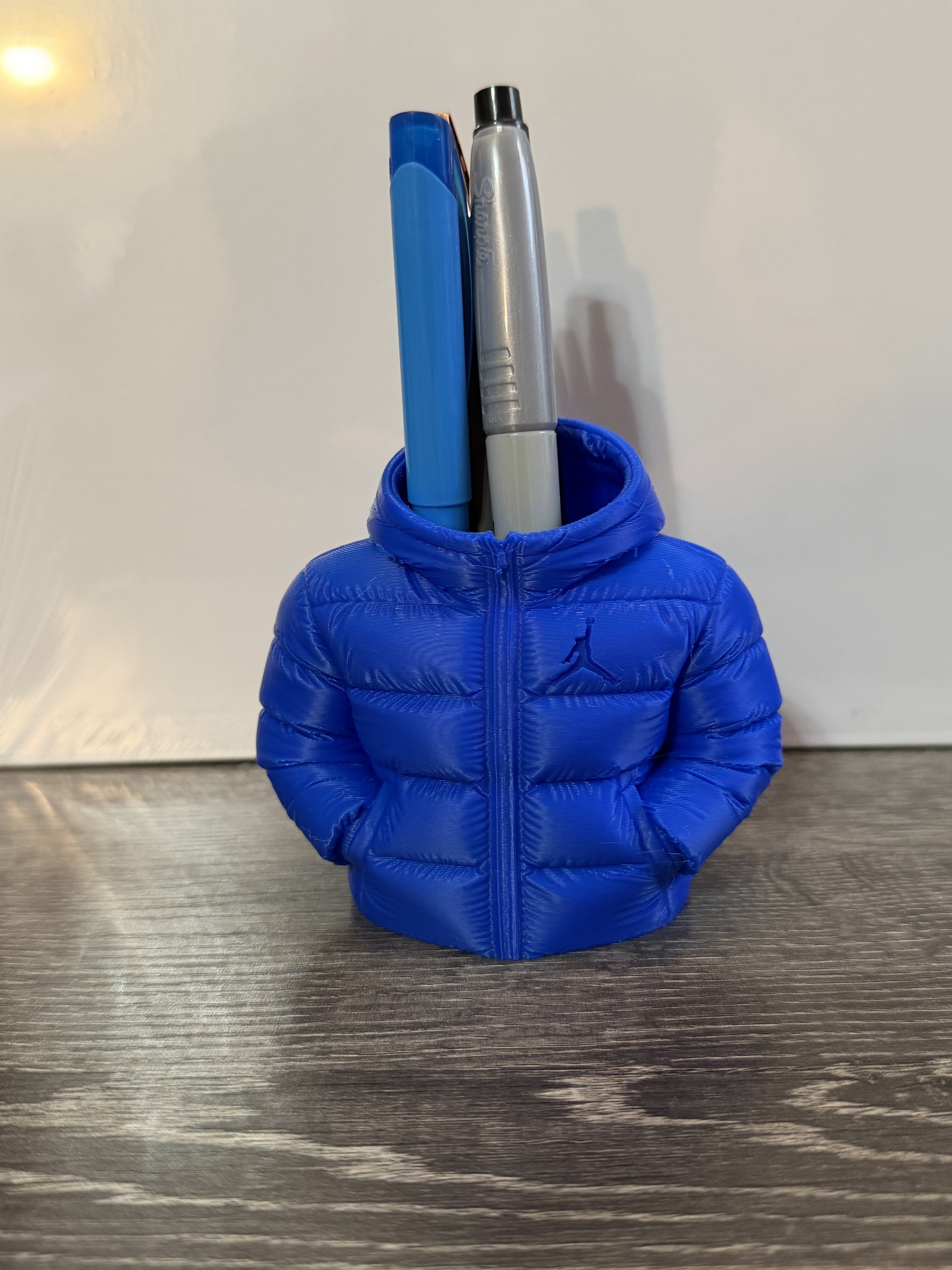 Blue Jordan puffer jacket pencil holder with pens inside