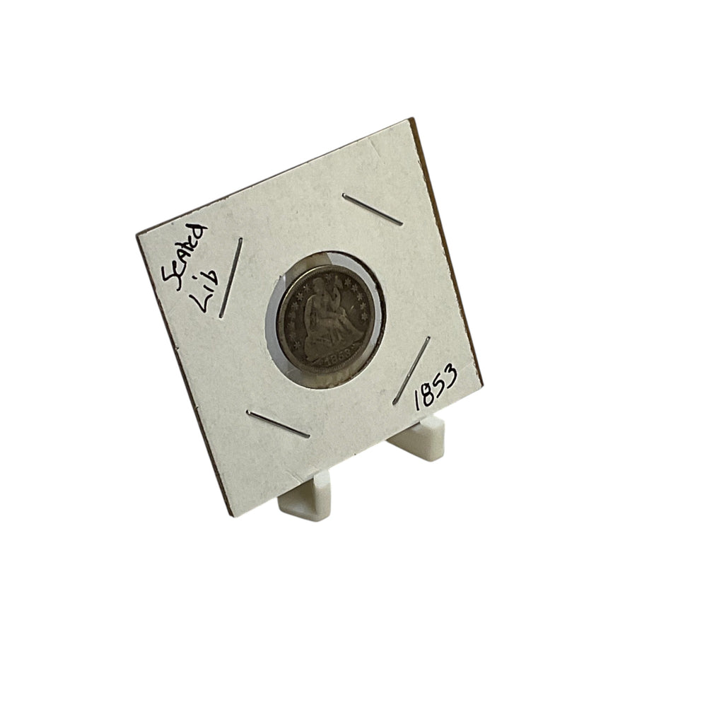 White display stand holding a coin in a cardboard holder